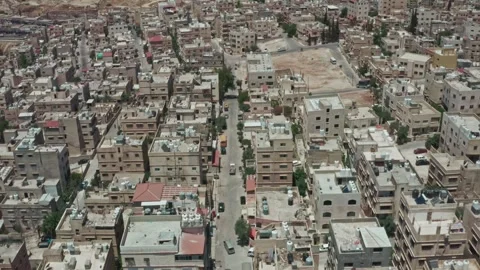 Bird Eye push out shot for a chaotic urban neighborhood in Amman - Jordan Stock Footage 297236527