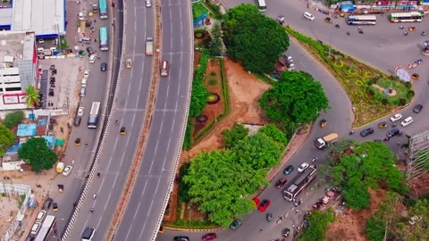 Bird eye view of 6 Lane road flyover with roundabout, traffic flow and BHEL Stock-Footage 342050257