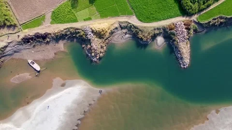 Bird eye view of bank of river with boat Stock Footage 199243202