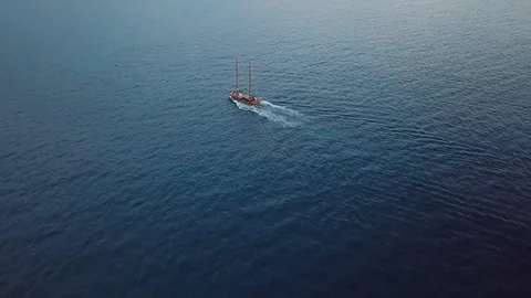 Bird eye view on a boat at open sea in the middle of nowhere. Sailing in the Stock Footage 95423188