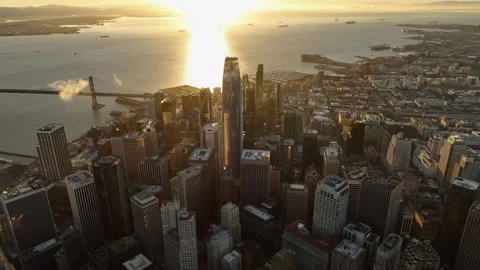 Bird-eye view of downtown San Francisco with sunbeam reflection on water at dawn Stock Footage 299906841