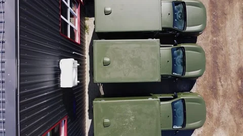 Bird eye view drone shot of several 4x4 trucks turned into ambulance Stock Footage 204860706