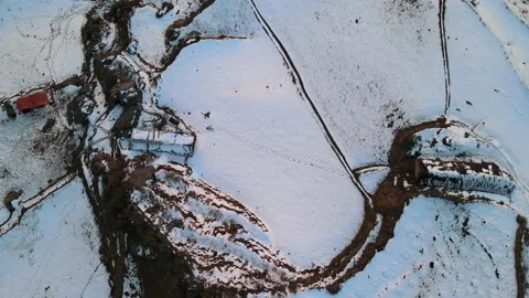 Bird eye view from drone of snow covered mountain top flat ground. Video stock 157971554