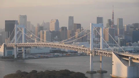 Bird eye view of Rainbow Bridge and Tokyo skyline from Odaiba. Filmed in 4K Stock-Footage 107328075
