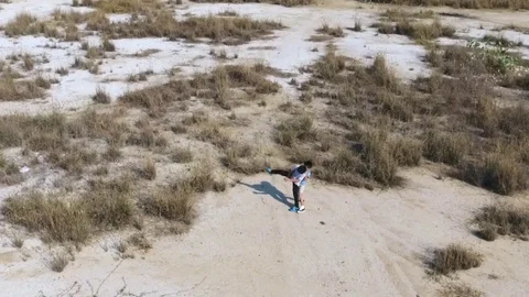 Bird eye view from remote control flying drone of two asian boy running  库存影片 71900992