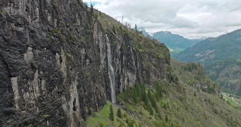 Bird Eye View of a Scenic Waterfall in the Dolomite Alps, Italy Stock Footage 281573751