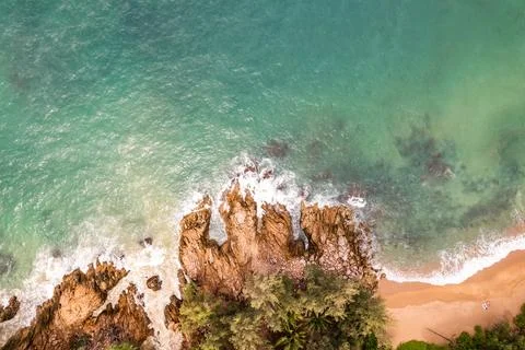 Bird eye view seashore with waves crashing on rock cliff, Beautiful waves s.. Stock Photos