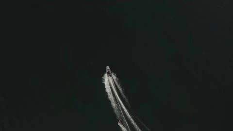 Bird eye view of speedboat with wake on a dark water 動画素材 201818570