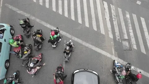 Bird eye view of a traffic light intersection, shot from a pedestrian bridge Stock Footage 233663819
