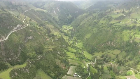 Bird eye view of a vally with a large river and a dirt road Stock Footage 142752755