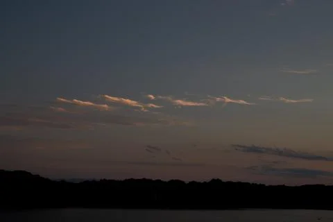 Bird feather looking clouds at sunset time in Japan. Stock-Fotos