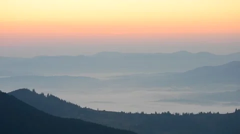 Bird flies on background of mountains just before dawn Stock Footage 54131051