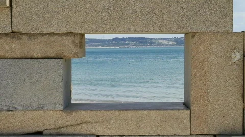 Bird Flight by the Beach Framed In A Small Stone Window 스톡 동영상 765532