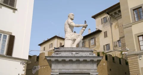 Bird flying away from statue of sitting man in Florence,Italy Stock Footage 127233989
