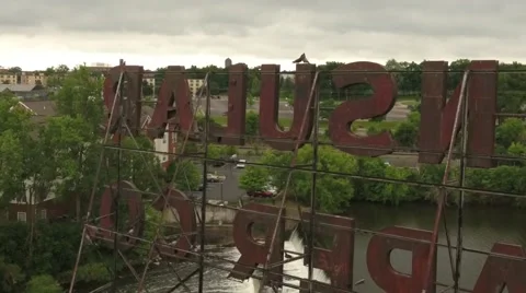 Bird Flying off old sign (drone footage) Stock-Footage 65297976