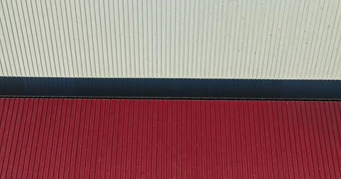 Bird Migration Flock Flying Over Red And White Roof On Sunny Day Aerial Steady Stock Footage 289417716