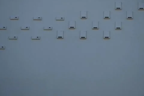 Bird nesting boxes on white wall with copy space Stock Photos