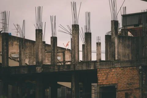 A bird is perched on a building Stock Photos