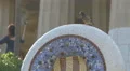 Bird sitting on a sculpture at Park Guell, Barcelona 4k or 4k+ Resolution
