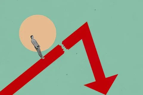 Bird standing on a broken red arrow pointing down 스톡 사진