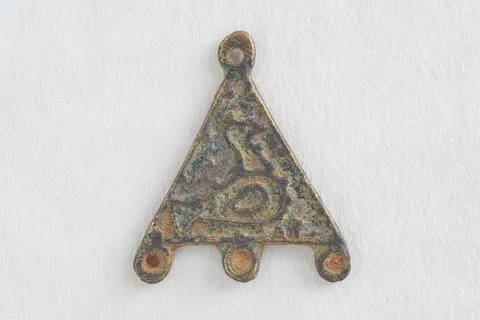 A bird  triangular metal features a hole at the top for suspension and thre.. 스톡 사진