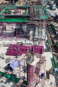 Bird-view construction site, workers work structure with cement  steel and me Stock Photos
