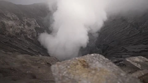 Bird view of the crater rim of an active Stock Footage 258313771