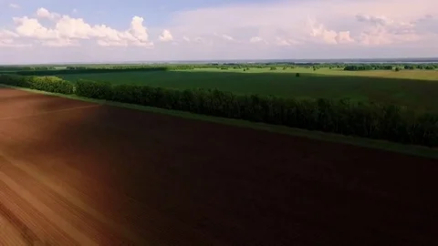Bird view two tractor on ploughed field 4 Stock Footage 69219042