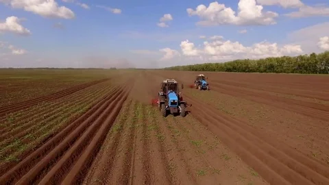 Bird view two tractor on ploughed field 7 Stockbeeldmateriaal 69219112
