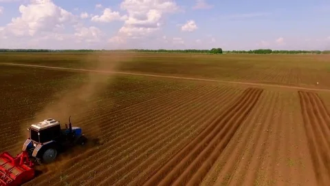 Bird view two tractor on ploughed field 17.23.37 Stock Footage 69219187