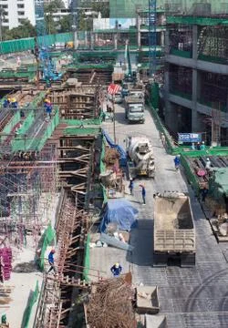 Bird-view workers work structure with cement  steel and metal in construction Stock Photos