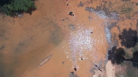  bird view of young people carrying life  buoys throughout of the flooded field Stock Footage 86802886