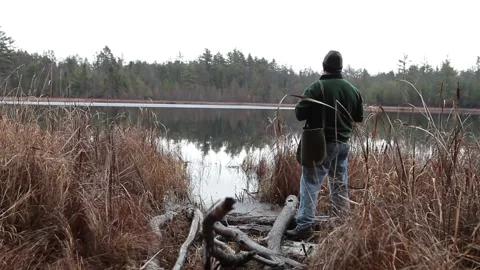 Bird Watcher in Forest Looking through Binoculars Wide Shot 動画素材 172265023