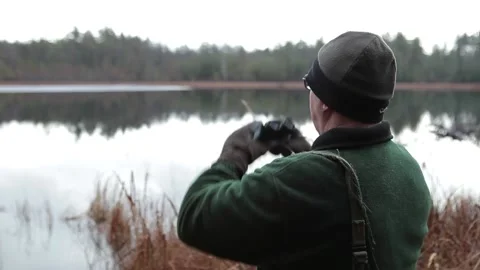 Bird Watcher Hiking in Forest Looking through Binoculars 動画素材 172265005