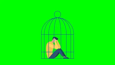 Birdcage falls on top of a sad guy sitting on the ground. Sad man locked in cage Stock Footage 283667170