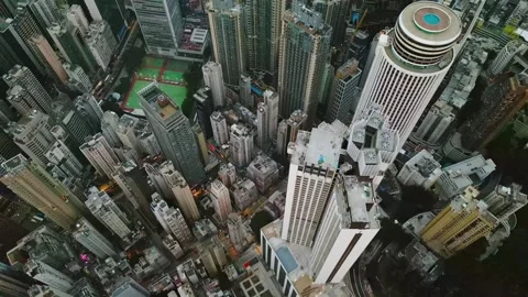 Birdeye geometric composition of towering high rises and interlocking rooftops Stock Footage 343900728