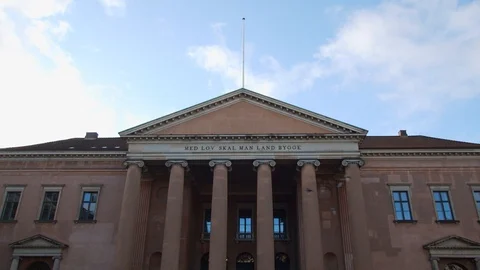 Birds Dramatically Flying In Front Of Copenhagen Court House. Stock Footage 125689336