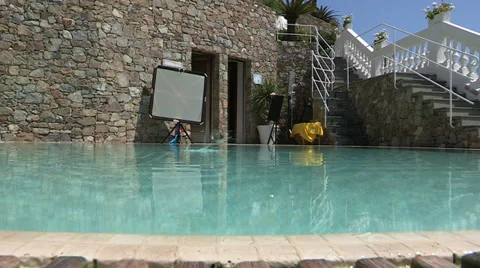 Birds drinking in swimming pool Stock Footage 33940933