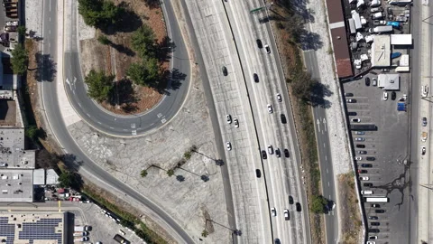 Bird’s Eye Aerial Drone Reverse Dolly Over 5 Freeway Off-Ramp Traffic in Los Stock Footage 334033406
