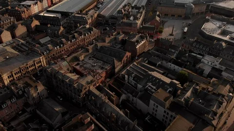 Birds eye aerial Inverness Scotland. Moves up to train station and bridge. Stock Footage
