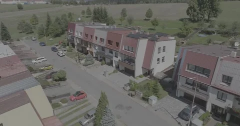 A Bird's-Eye Angled pull push over a retro neighborhood Czech Stock Footage 253127919