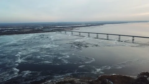 Bird's-eye bridge across the spring river and city Video stock 128284669