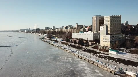 Bird's-eye bridge across the spring river and city Stock Footage 136651436