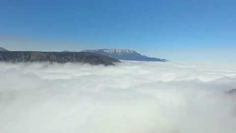 Bird's-eye drone view over a thick layer of clouds in California, USA Stock Footage 138643345