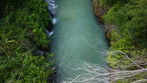 Bird's Eye Flight Over Waterfall with Upward Camera Reveal Stock Footage 340144230