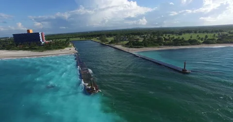 Bird's-eye panoramic view around the shore of Caribbean Sea, piers conducting a Stock Footage 68178680