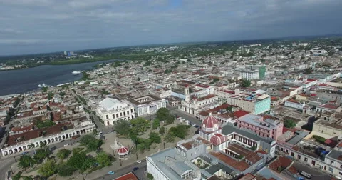 Bird's-eye panoramic view to roofs of ancient houses, chapel with a dome, Stock Footage 68216064