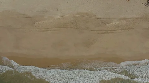Birds Eye Perspective On Empty and Wide Beach With Big Waves Stock Footage 128833684