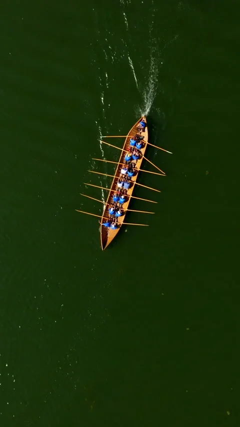 Bird's Eye Perspective of Team Rowing in a Historic Wooden Longboat, Finland Stock Footage 332934458