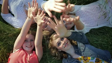 Birds Eye View Of 4 Sisters, They Raise Their Hands And Wave Goodbye Stock Footage 42906554